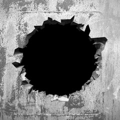 Dark cracked broken hole in concrete wall. Grunge background