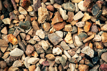 River pebbles top view background as gravel stone
