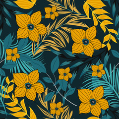 Trending bright seamless background with colorful tropical leaves and flowers on blue background. Vector design. Jungle print. Floral background. Printing and textiles. Exotic tropics. Fresh design.