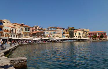 Fototapeta na wymiar Chania, Crete, Greece. June 2019. The busy eating and shopping area around the Old Venetian Harbour of Chania, Crete