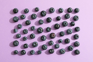 Flat lay composition with berries on color background, space for text