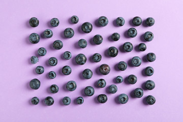 Flat lay composition with berries on color background, space for text