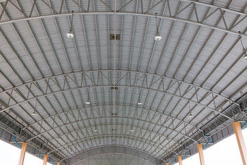 Steel roof structure. Moonlight bulb. Steel structure with roof tiles. Architectural structure of roof. Large roof layout used for industrial plants.