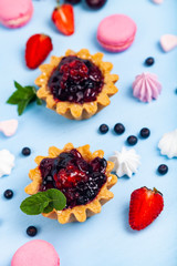 Small berry cake and ripe berries