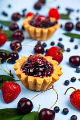 Small berry cake and ripe berries