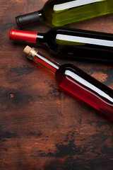 Various wine bottles on wooden table