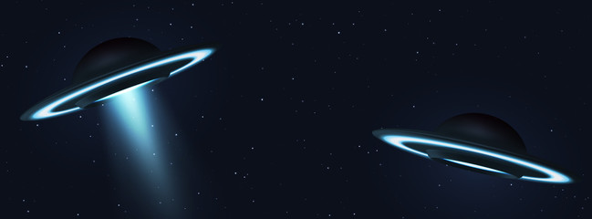 Unidentified flying object. Two UFOs flying on the horizon night sky. Futuristic ufo on Space stars background. © lauritta