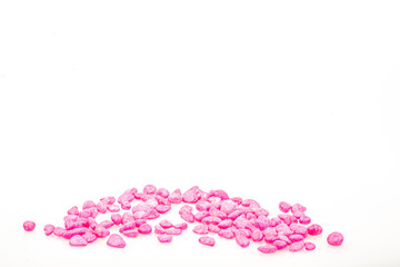 Pink pebbles stone with empty copyspace area for slogan or advertising text message, over isolated white background.