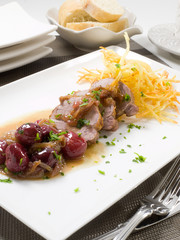 plato receta de cocina con carne guisada con verduras y patatas. cooking recipe dish with stewed meat with vegetables and potatoes.