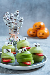 Spooky green kiwi monsters for Halloween party