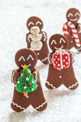 Funny Gingerbread cookie men with tiny marzipan snowman