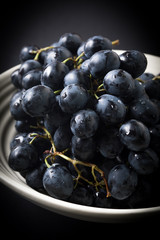 Dark grape in bowl.