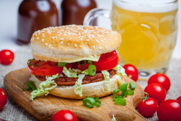 Homemade hamburger with fresh vegetables.