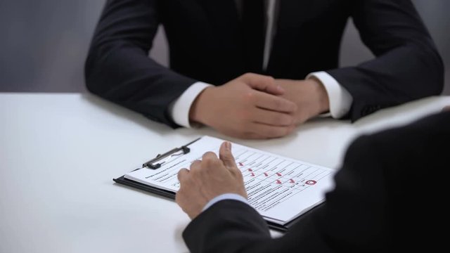 Employer filling data in job candidate test, shaking hands, first impression