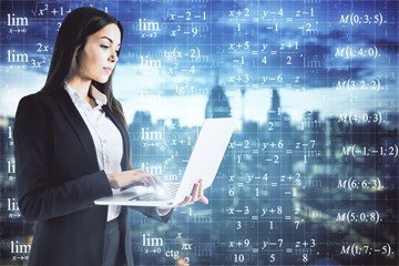 Businesswoman looking at formulas