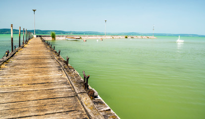 Pier of Balatonlelle lake in a sunny day in Hungary..