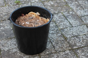 A bucket filled with bokashi. This photo is taken just before digging the bokashi down in the soil. Bokashi is a type of fermented wastemanagement of organic foodwaste.