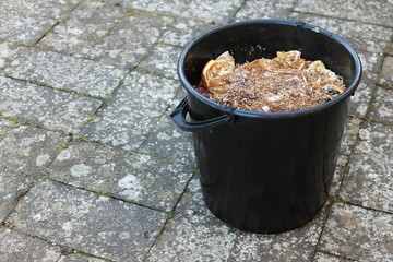 A bucket filled with bokashi. This photo is taken just before digging the bokashi down in the soil....