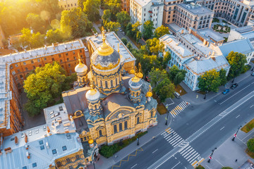 Aerial view of the Assumption Church and the embankment of the Neva River in Petersburg in the evening at sunset.