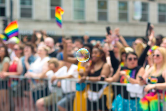 A bubble floating in front of a crowd at the June 30th, 2019 Chicago Pride Parade