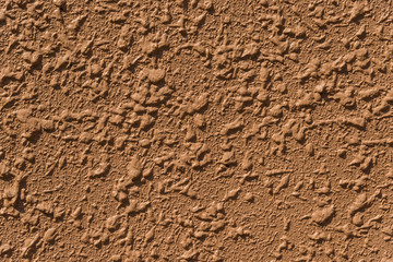 Brown concrete wall with rough surface as background