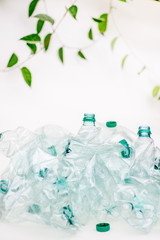 Greens wraps and grows on empty plastic bottles. Sort garbage. Ecosystem recovery