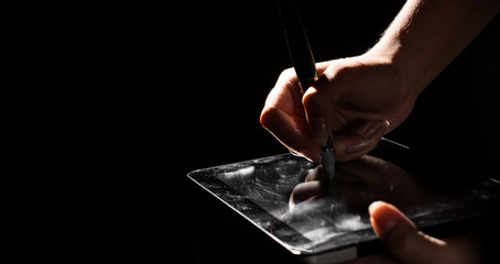 Digital Signature Concept. female hands digitally sign a digital tablet on black dark background with copy space.