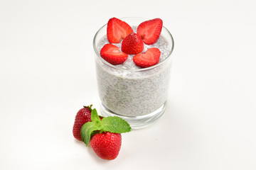 Chia pudding with strawberry and mint on a white background. Space for text or design.