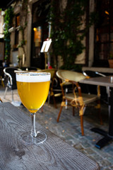 Famous Belgian beer served outside in small old cafe in special Belgian beer glass