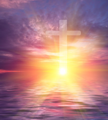 Cross on the background of the setting sun with rays, symbolizing the hope of heaven and...