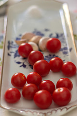 Cherry tomato with garlic on a table