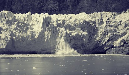Chunk of Ice falling off Glacier, in Glacier Bay National Park and Preserve