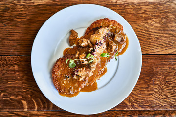 Fried potato pancakes with meat sauce