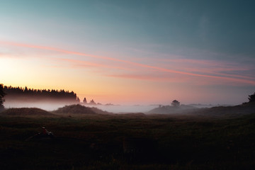 Beautiful natural morning light at dawn with fog meadows. Landscape countryside view of Denmark in Europe