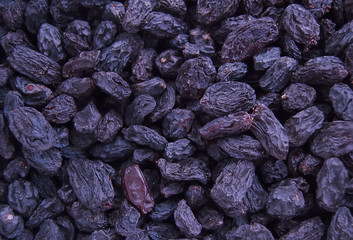 Macro photo of tasty organic black raisins.