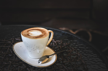 Cup of latte on glass table. Latte Art. 