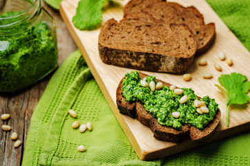 vegan cilantro pine nuts pesto on a wooden background