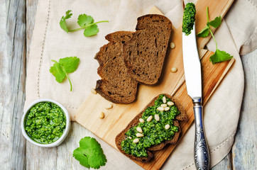 vegan cilantro pine nuts pesto on a wooden background