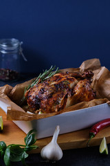 Chicken baked in the oven with spices, lemon, herbs and young potatoes.