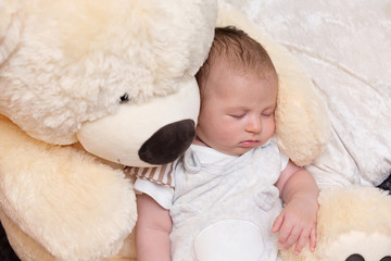 Baby Boy Sleeping with Big Teddy Bear