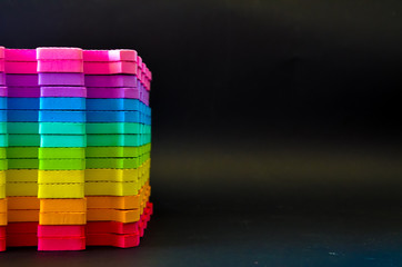 Rainbow stripes, steps with leaves, futurism abstraction on a black background