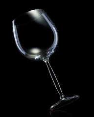 Empty glass for red wine isolated on black background.