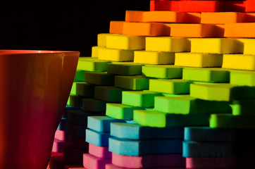 Rainbow stripes, steps with leaves, futurism abstraction on a black background