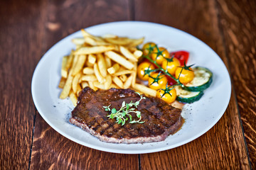 Beef barbecue steak with french fries