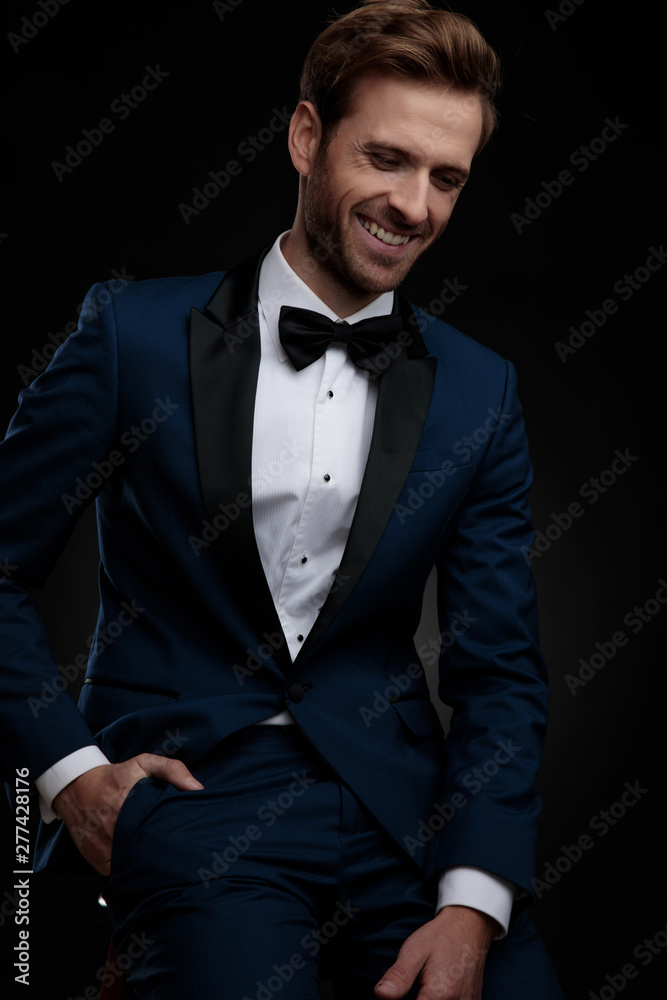 Canvas Prints Cheerful groom laughing and holding his hand in his pocket