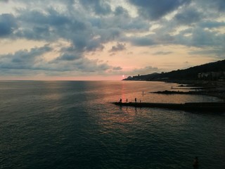 Fishing in the Sochi Sea on the background of a beautiful sunset