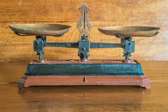 Vintage bascule on the old wooden background