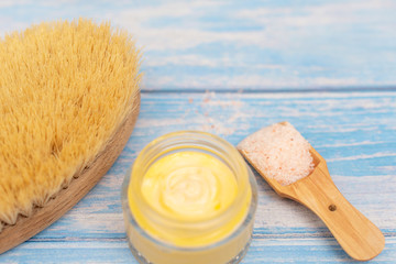 skin care products - cream, body brush and salt for scrub