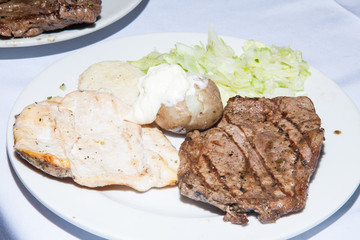 serving of grilled meat served on the table