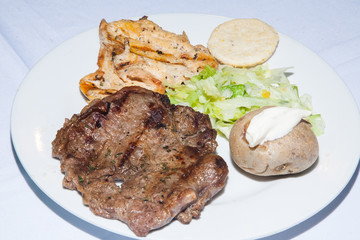 serving of grilled meat served on the table